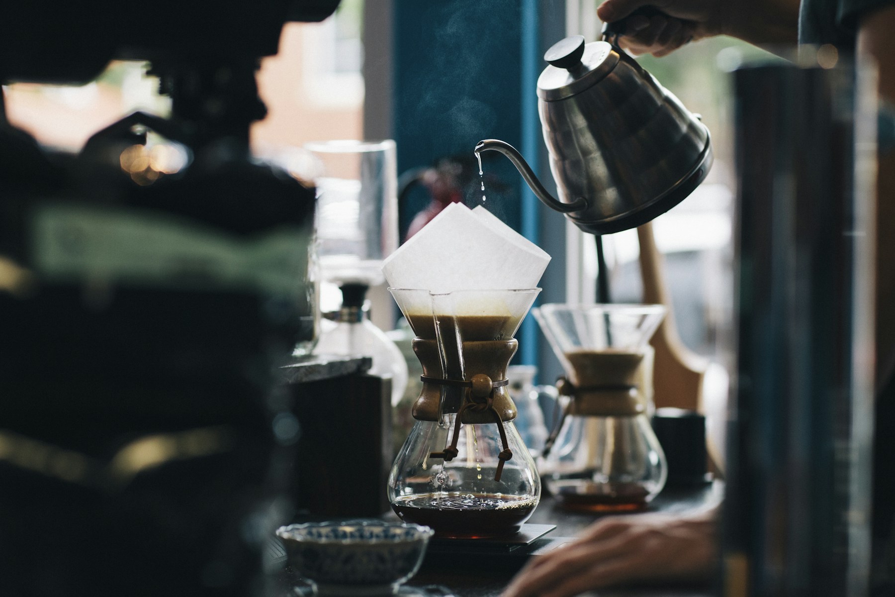 Coffee being carefully poured at a café